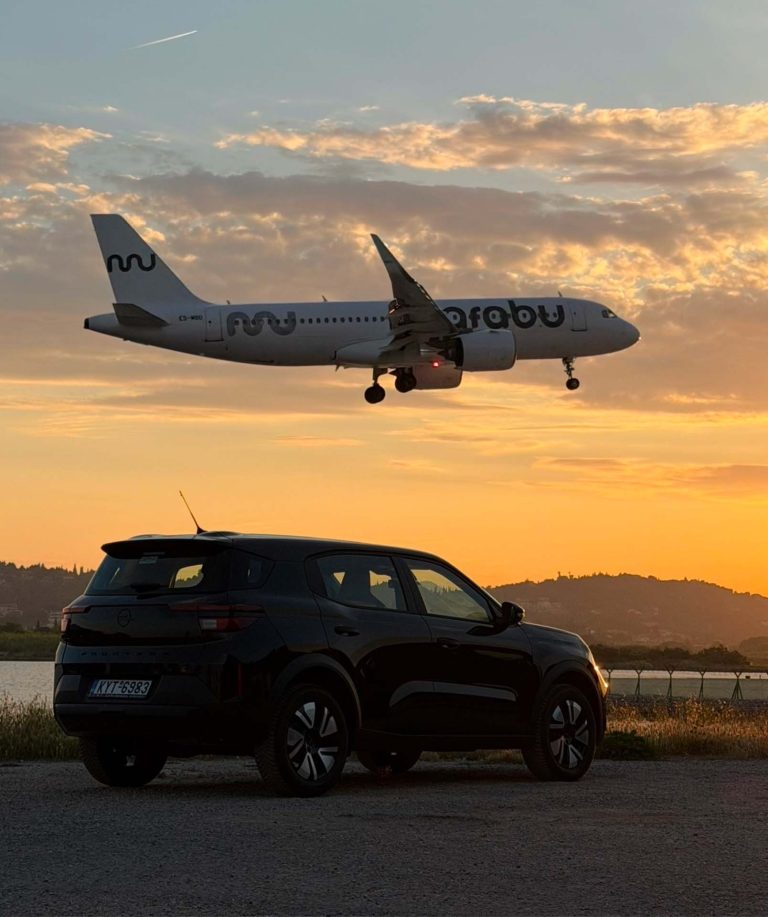 CARFINO Corfu Car Rental plane arriving during sunset