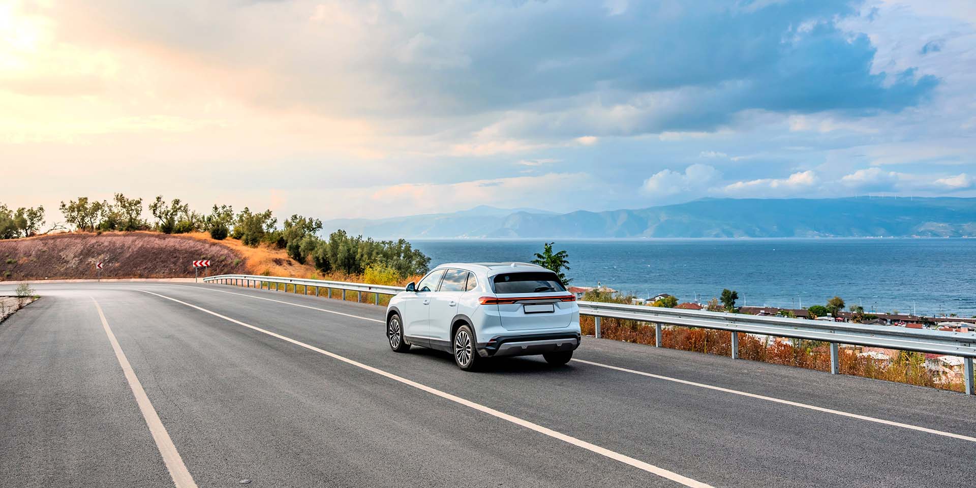CARFINO Corfu Car Rental car in a coastal road